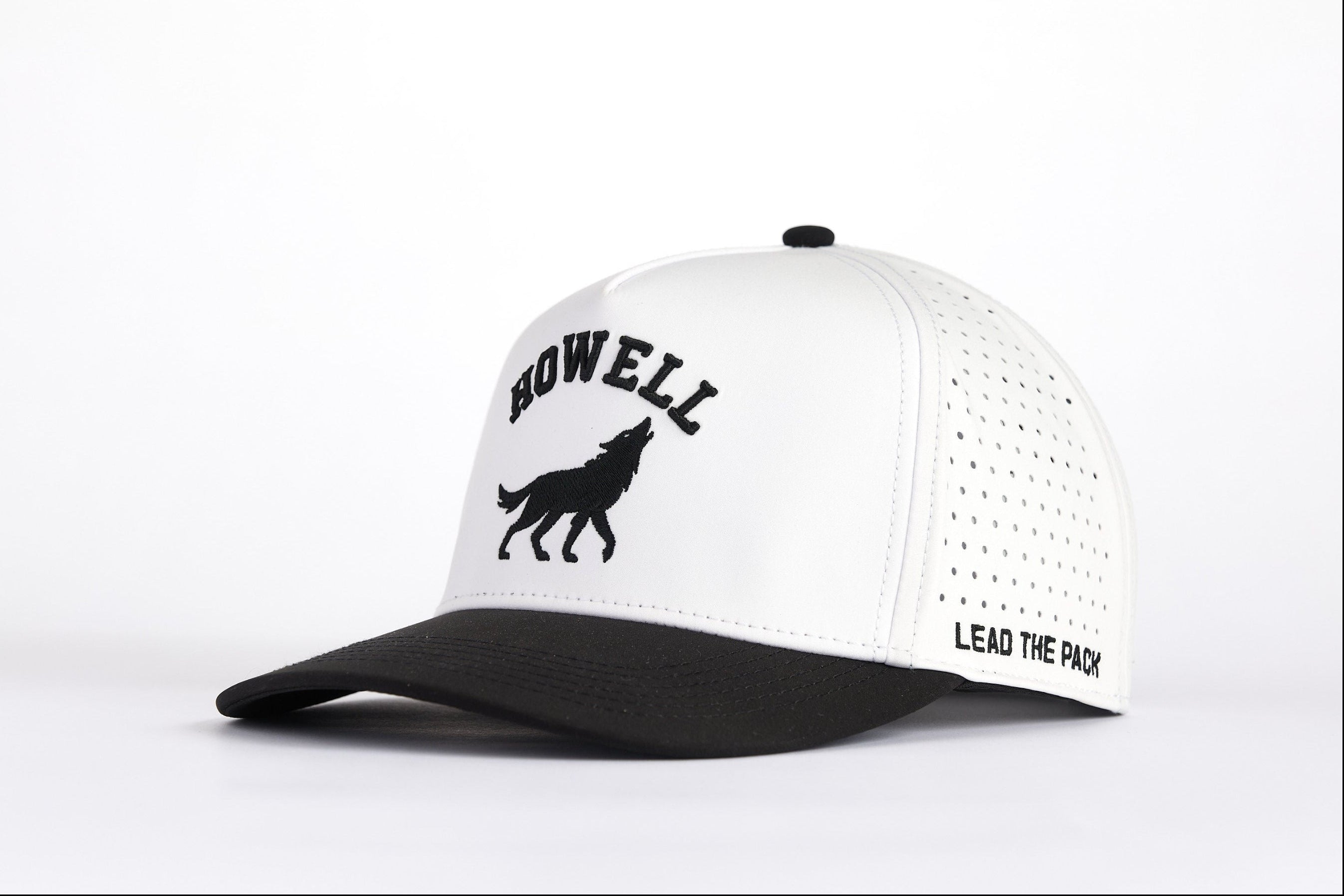 White and black cap with 'HOWELL' and wolf logo on a white background