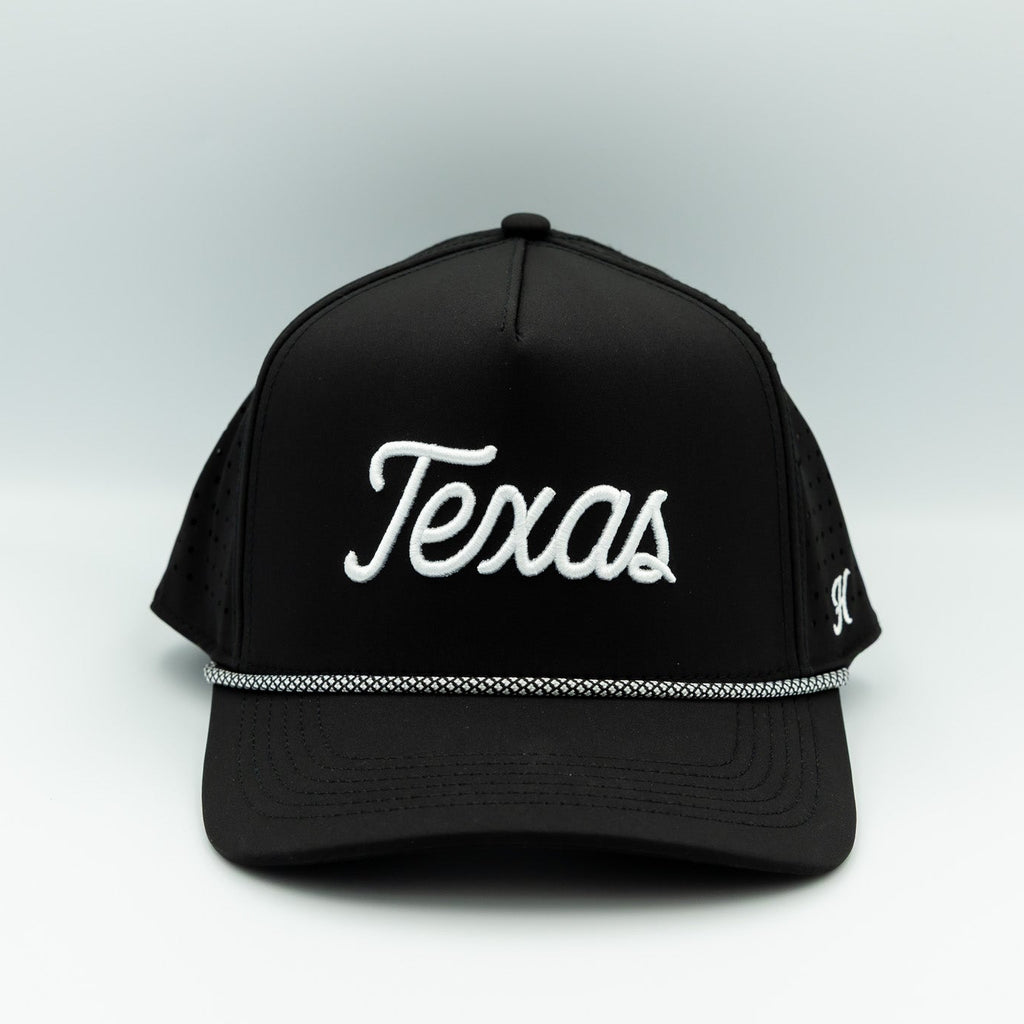 Black cap with 'Texas' printed on it against a white background