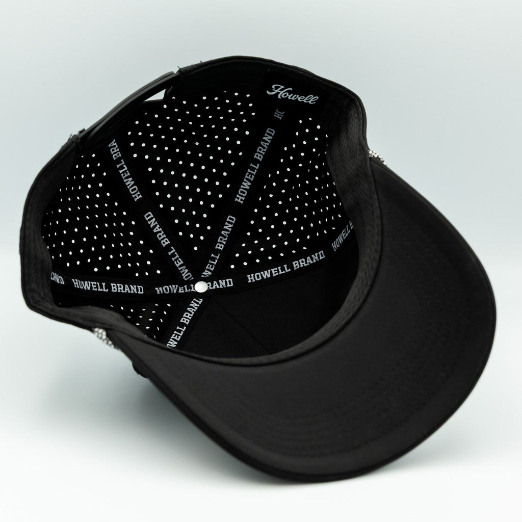 Black cap with white text on a light gray background