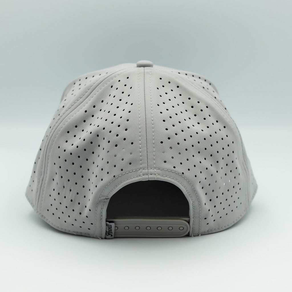 Gray cap with perforated design on a white background