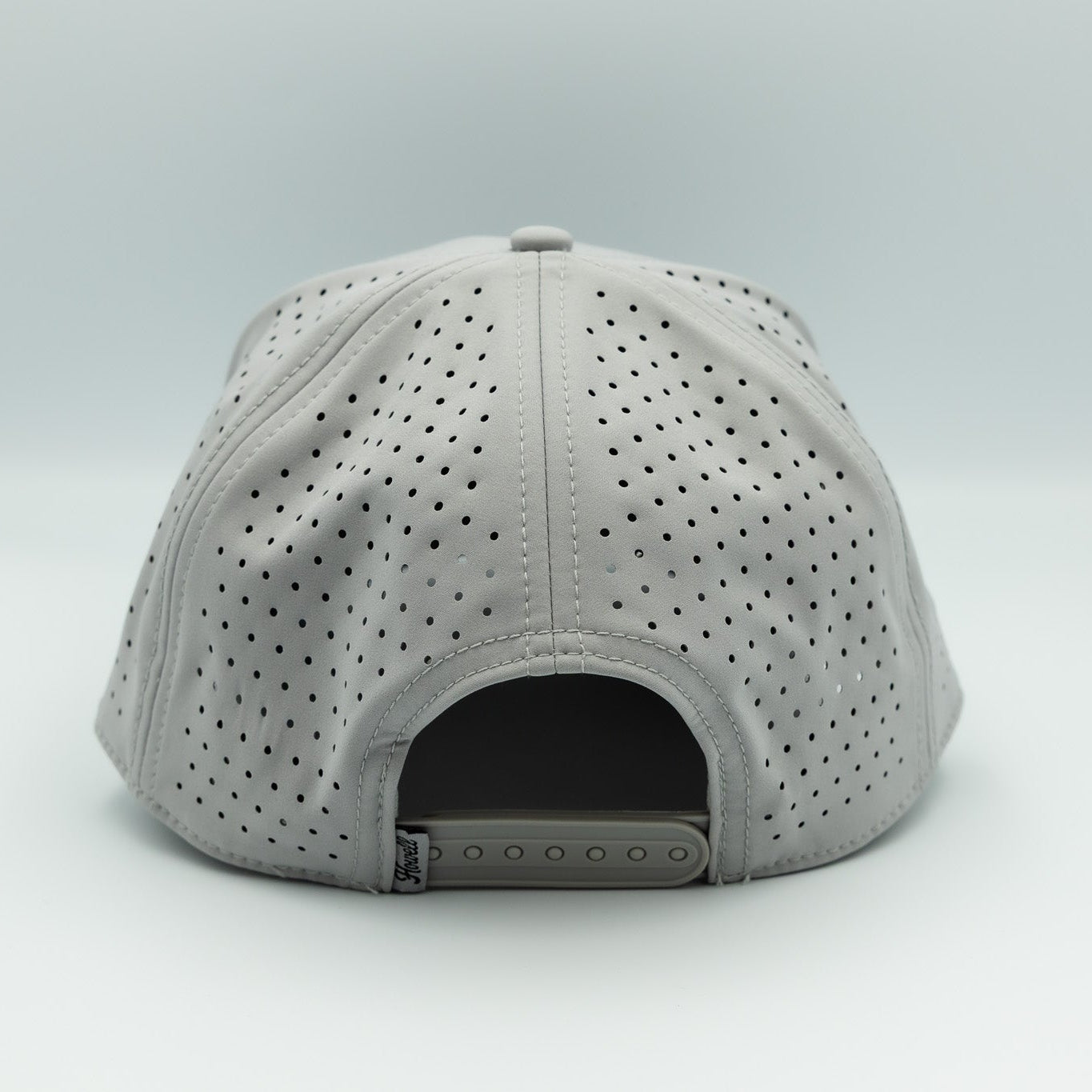 Gray cap with perforated design on a white background