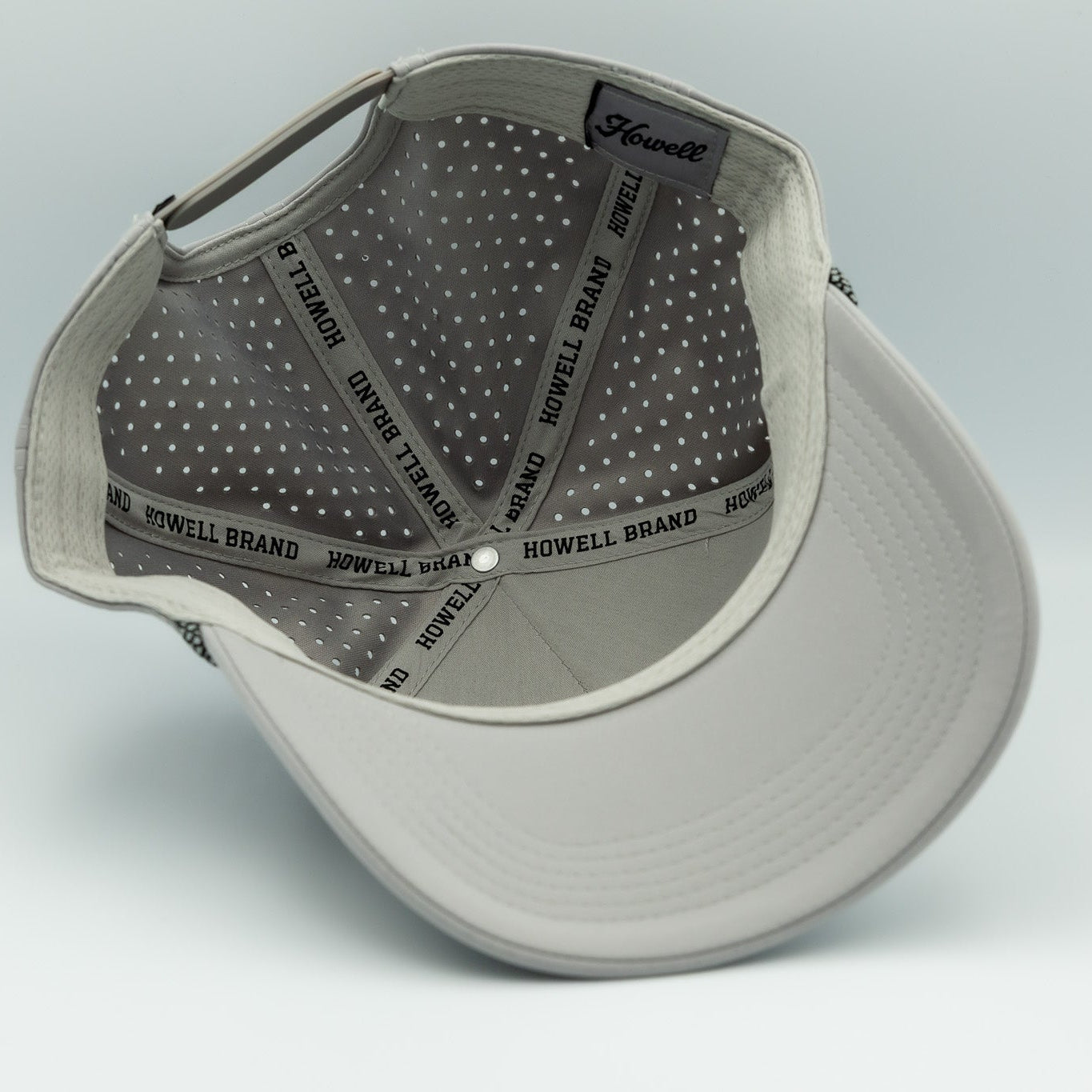 Gray cap with branding on a light gray background