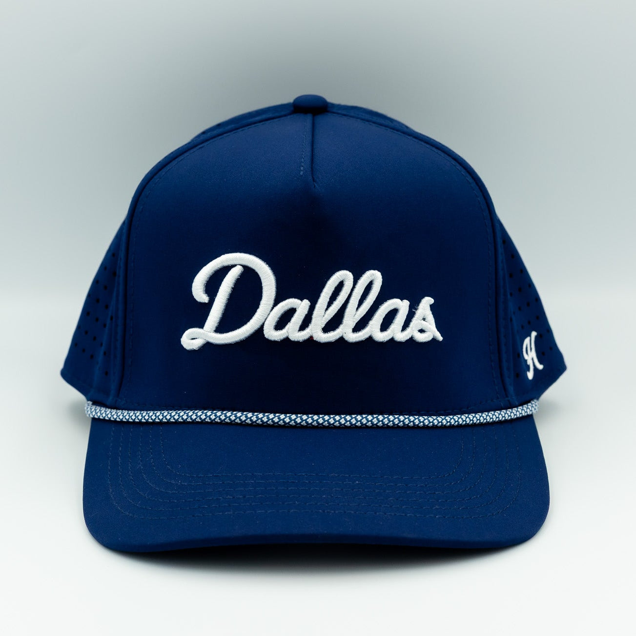 Blue cap with 'Dallas' text on a white background