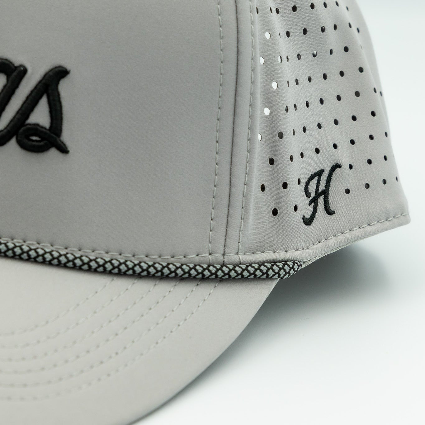 Gray cap with black logo and text on a white background