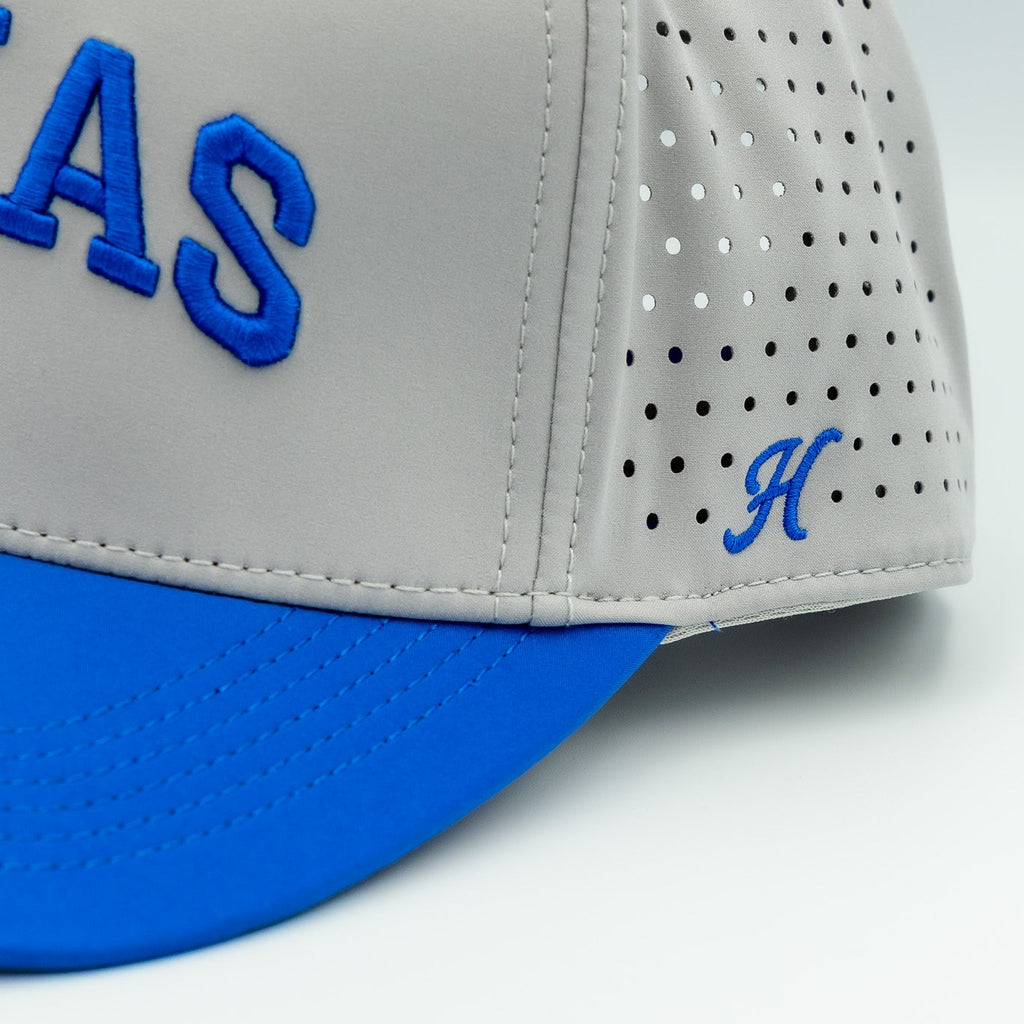 Gray cap with blue visor and 'H' logo on a white background